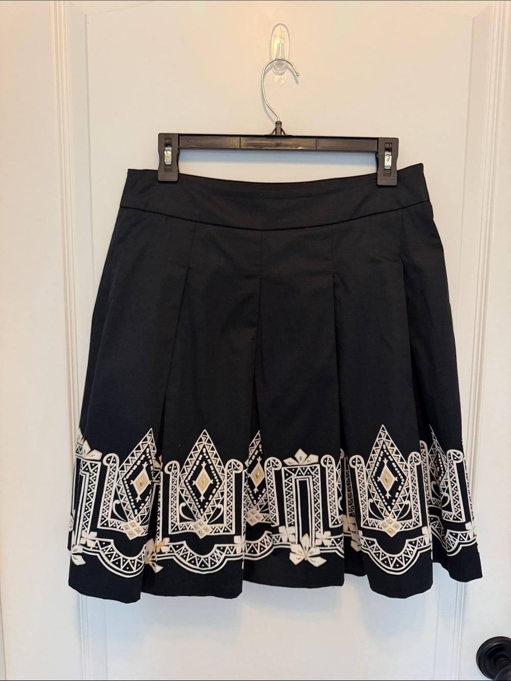 White House Black Market Black Pleated Skirt with Geometric Design along the Hem